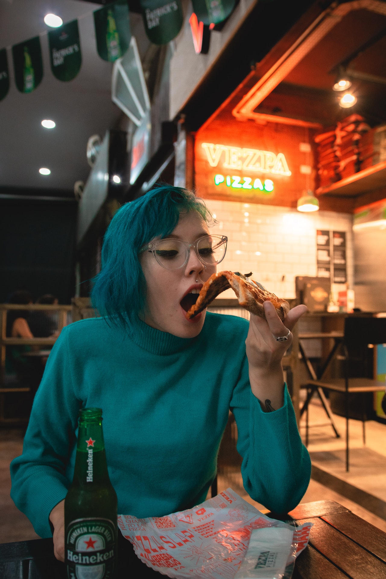 Photo by Athena: https://www.pexels.com/photo/woman-eating-pizza-2323182/